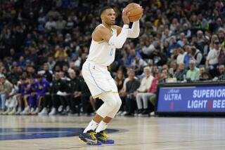 Los Angeles Lakers guard Russell Westbrook (0) shoots during the first half.
