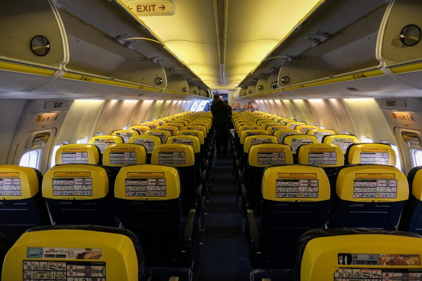Perspective with the seats and the aisle inside a Ryanair low cost budget airline in the European route FR1818 from Thessaloniki Makedonia Airport SKG LGTS in Greece to Eindhoven Airport EIN EHEH in the Netherlands. The interior of the Boeing 737-800 aircraft with registration EI-EBM is seen during the flight, the seats, the legroom, seatbelt, aisle, spacing, emergency exit, inflight magazine, emergency exit, window view, safety card and air ventilation system and seatbelt fasten sign. (Photo by Nicolas Economou/NurPhoto via Getty Images)
