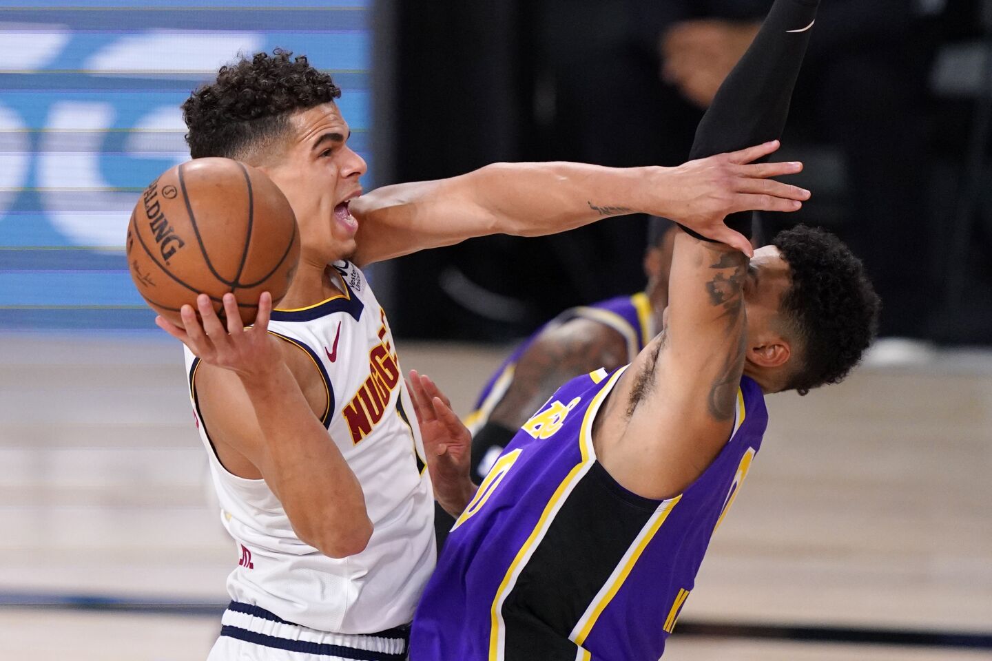 Nuggets forward Michael Porter Jr. attempts a layup against Lakers forward Kyle Kuzma during Game 5.