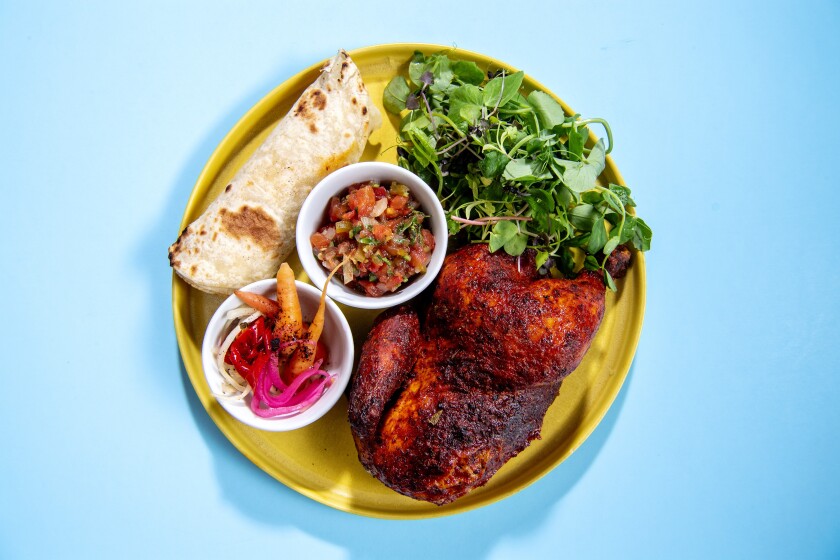 Sriracha-coated roasted chicken with pico de gallo and freshly made flour tortillas