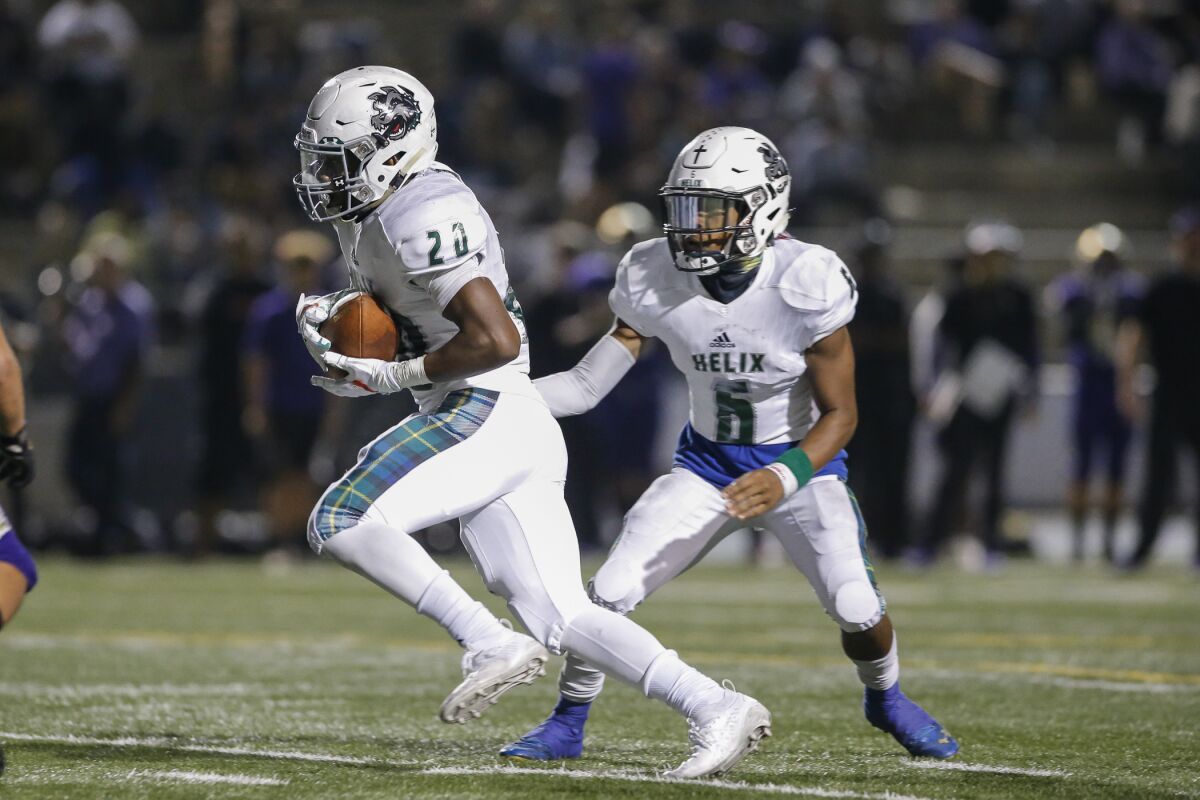 Helix running back Christian Washington (shown in an earlier game) rushed for 218 yards and four touchdowns in the Highlanders' win over Steele Canyon on Friday.