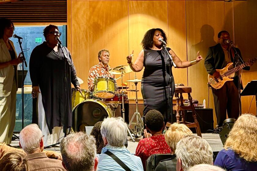 Daneen Wilburn performing with band members and vocalists at the May 2 First Thursdays event in Del Mar.