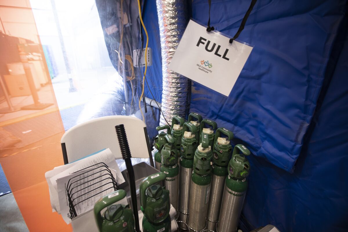Oxygen tanks are stored in a tent outside Martin Luther King Jr. Community Hospital.