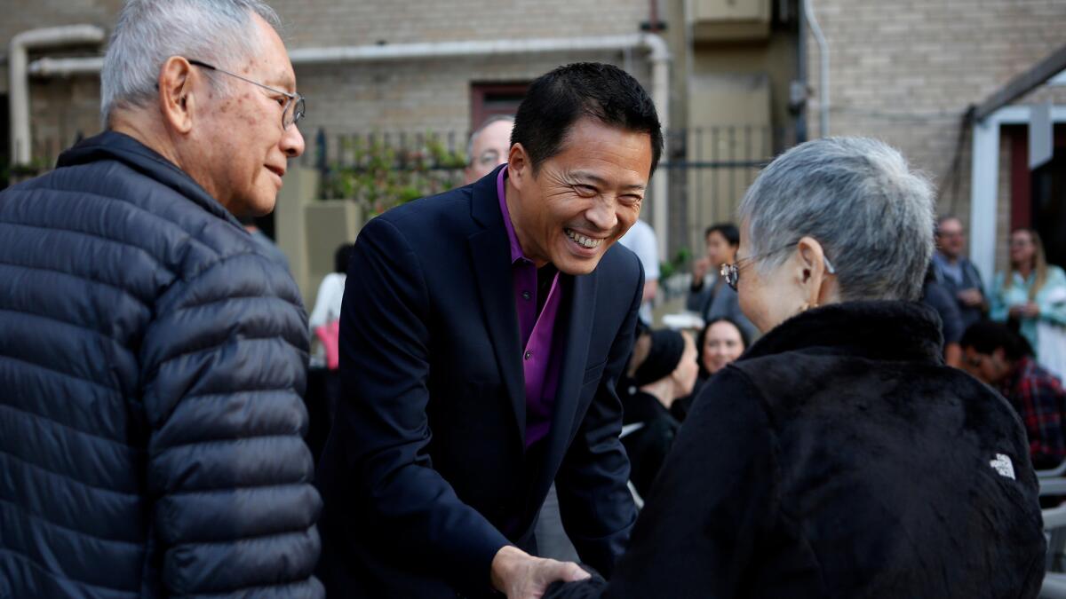 Tim Dang visits with Nancee and Roy Iketani before a recent performance.