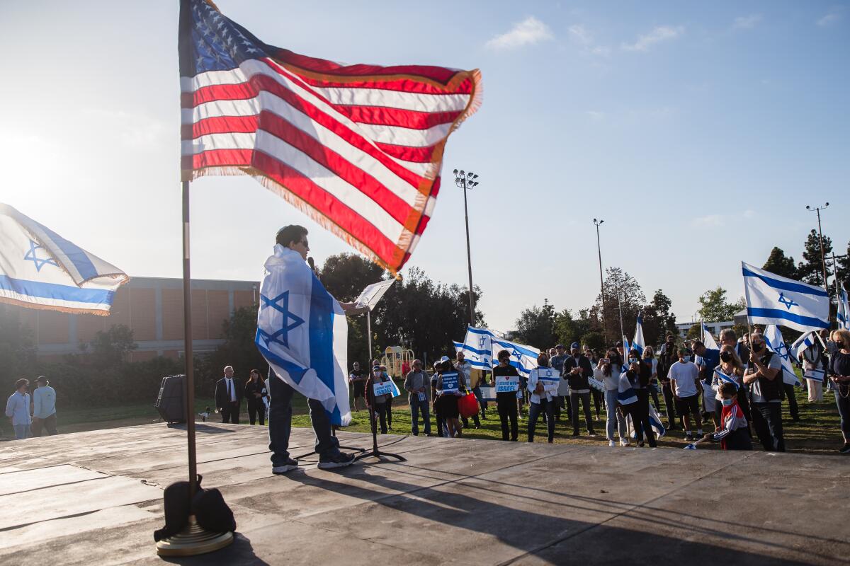 Micah Danzig, advisory board president for StandWithUs, speaks at a pro-Israel rally in La Jolla
