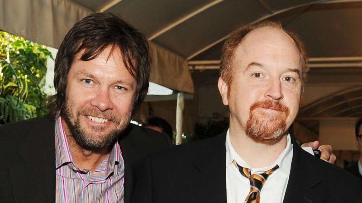 Dave Becky, left, and Louis C.K. in January 2012.