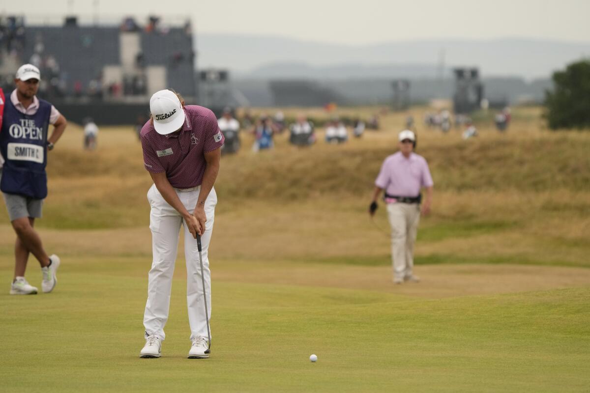 Cameron Smith, of Australia, putts on the 17th green during the final round of the British Open golf championship on the Old Course at St. Andrews, Scotland, Sunday July 17, 2022. (AP Photo/Gerald Herbert)