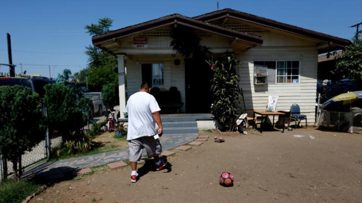 Jose Gomez, at his home on South Hicks Avenue in East Los Angeles, is among thousands whose yards have been tested for contamination from the former Exide plant.