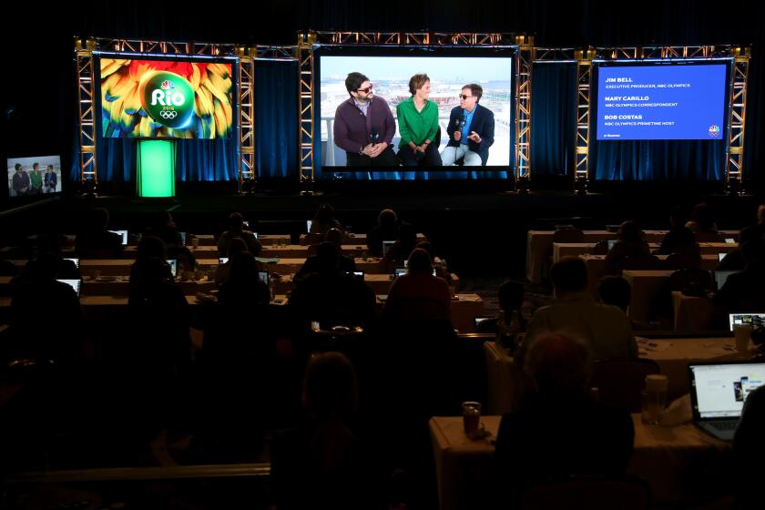 Executive producer of the NBC Olympics broadcast Jim Bell, NBC Olympics correspondent Mary Carillo and NBC Olympics prime-time host Bob Costas, from left, speak onstage via satellite at the 2016 Rio Olympics panel discussion at the 2016 Television Critics Assn. press tour