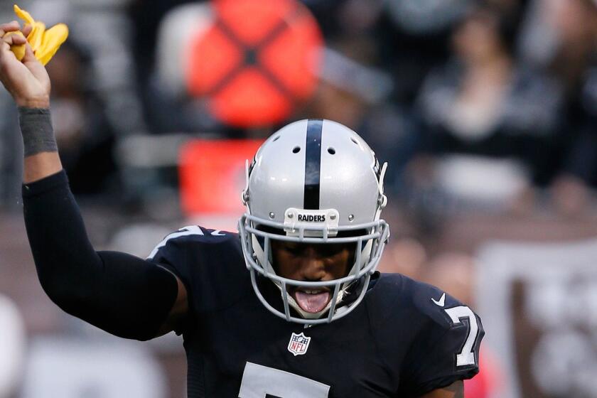 Raiders punter Marquette King dances with a penalty flag after the Buffalo Bills were penalized for roughing the kicker on Sunday.