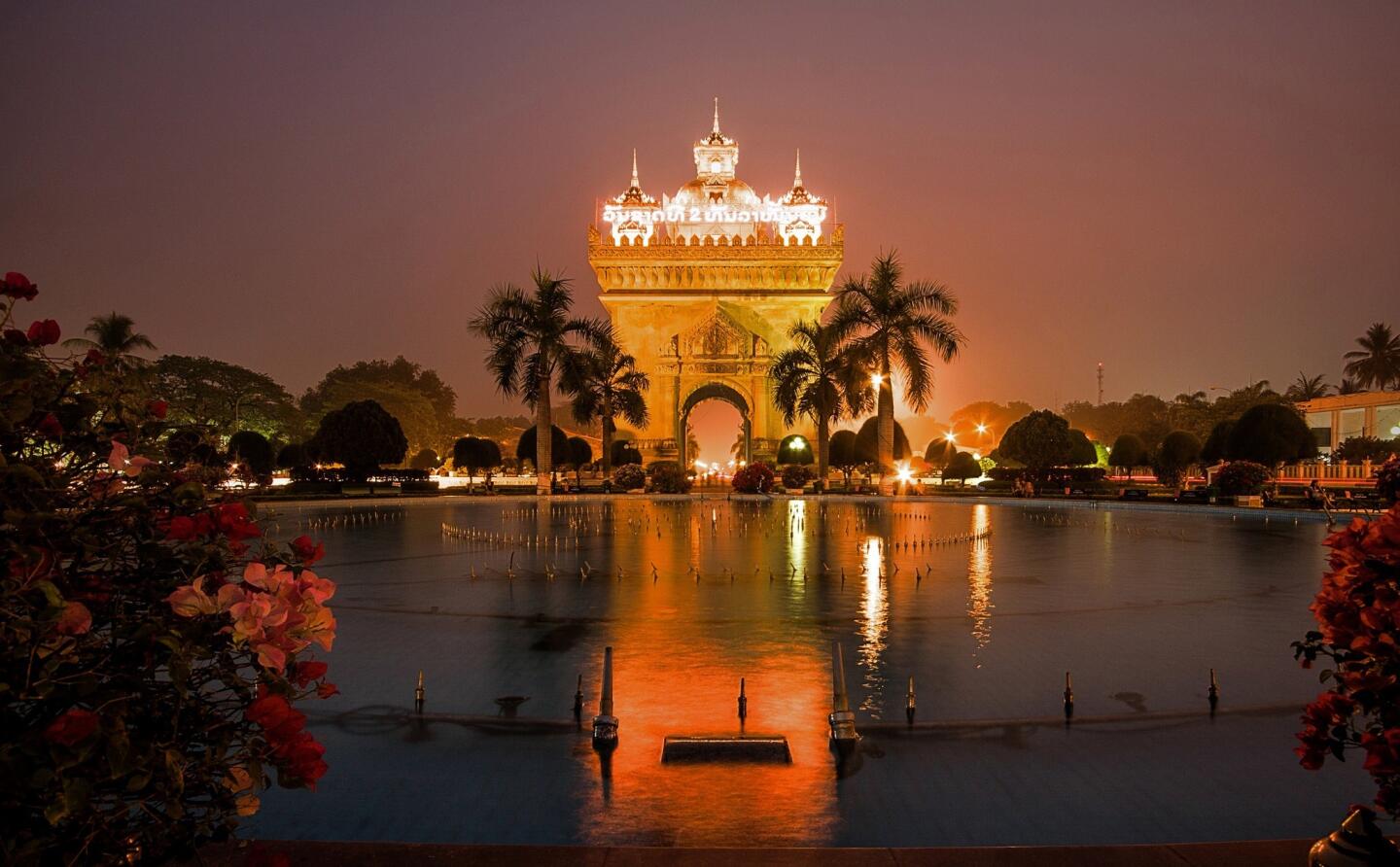 In case you momentarily forget that Laos has a French heritage, resulting from 50 years of French occupation, there is this impressive monument inspired by Paris' Arc de Triomph but with Lao kinnari motifs.