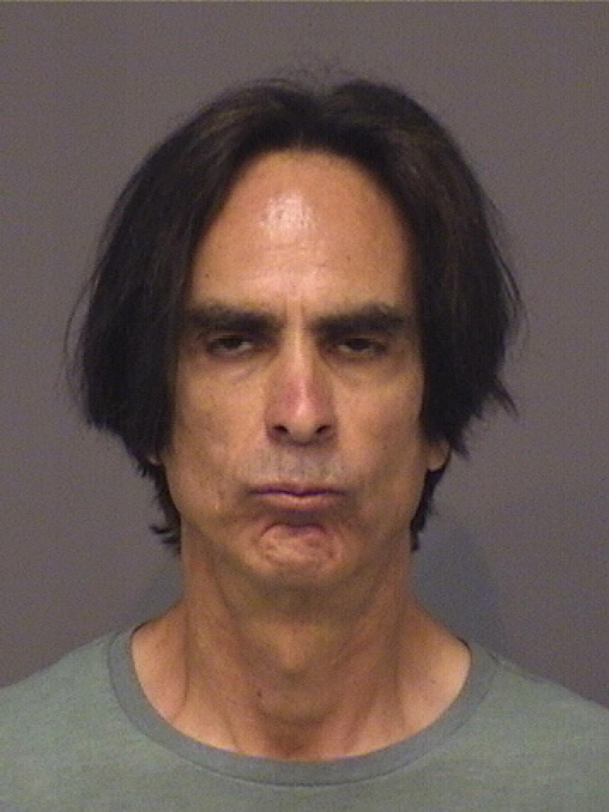 Charles Jacques was arrested at his home in Huntington Beach on Thursday morning.