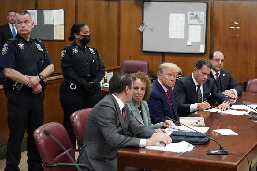 FILE - Former President Donald Trump sits at the defense table with his legal team in a Manhattan court, Tuesday, April 4, 2023, in New York. Trump's lawyers are demanding that the judge in his New York City criminal case step aside, echoing the former president's complaints that he's "a Trump hating-judge" with a family full of "Trump haters." Trump's lawyers said June 2, that Judge Juan Manuel Merchan has shown anti-Trump bias in previous cases related to the businessman-turned-politician. (AP Photo/Seth Wenig, Pool)