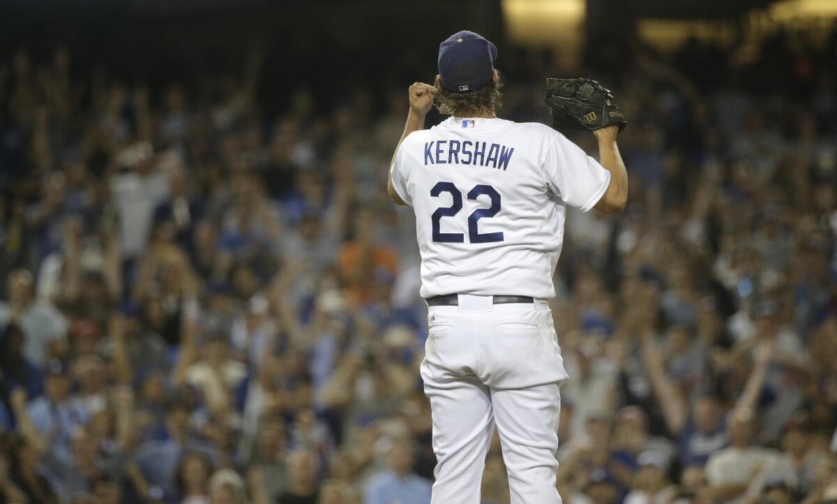 Los Angeles Dodgers' Clayton Kershaw celebrates the team's 2-1 win against the San Francisco Giants in a baseball game, Wednesday, Sept. 2, 2015, in Los Angeles. Kershaw struck out 15 to set a season career high with 251. (AP Photo/Jae C. Hong)