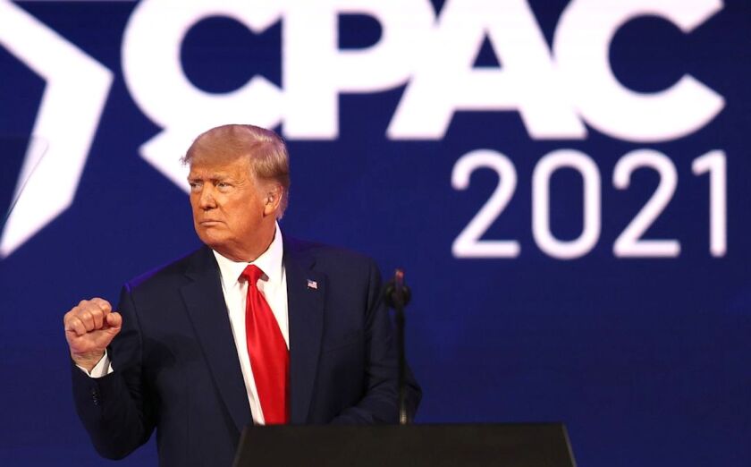 Former President Trump gestures to the crowd at the Conservative Political Action Conference in Orlando, Fla., on Feb. 28. 