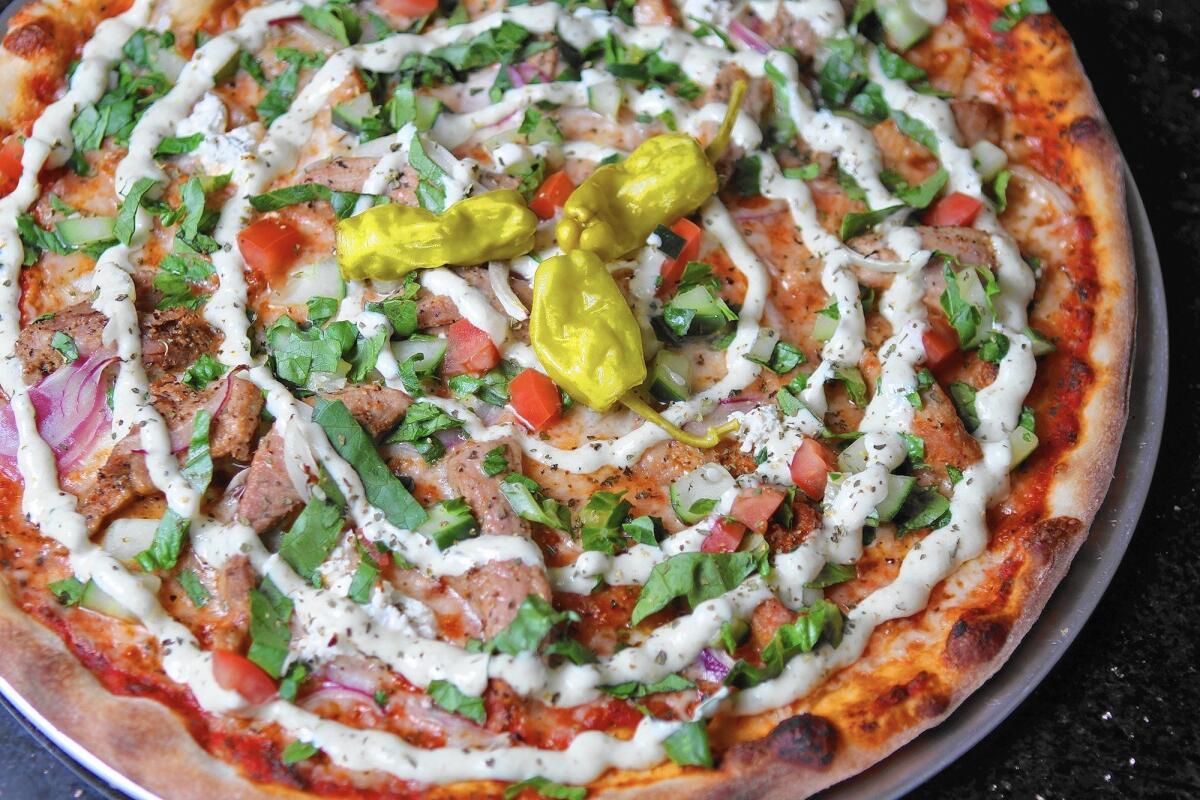 A favorite at Viking Pizza and Kabob in Glendale is the Viking pizza, made with mozzarella, kabobs, feta cheese, onions, fresh tomatoes, and feferoni peppers.