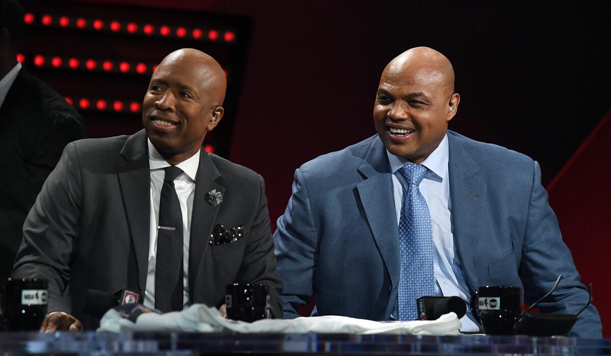 Basketball analysts Charles Barkley, right, and Kenny Smith laugh during a telecast of "NBA on TNT" on Jan. 5 in Las Vegas.