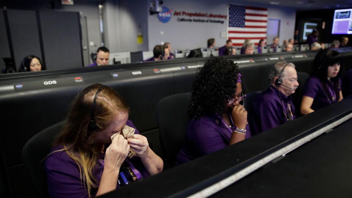 Engineer Nancy Vandermay wipes away tears in the mission control at NASA's Jet Propulsion Laboratory after confirmation that the Cassini spacecraft had perished in Saturn's atmosphere on Sept. 15.
