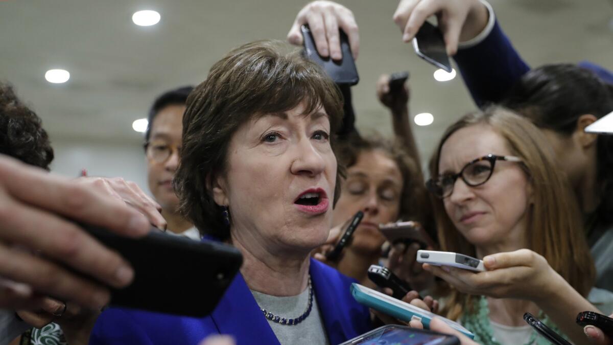 Sen. Susan Collins, R-Maine, speaks amid a crush of reporters after Republicans released their long-awaited bill to scuttle much of President Barack Obama's Affordable Care Act, at the Capitol in Washington, Thursday, June 22, 2017. She is one of four GOP senators to say they are opposed to it as written which could put the measure in immediate jeopardy.