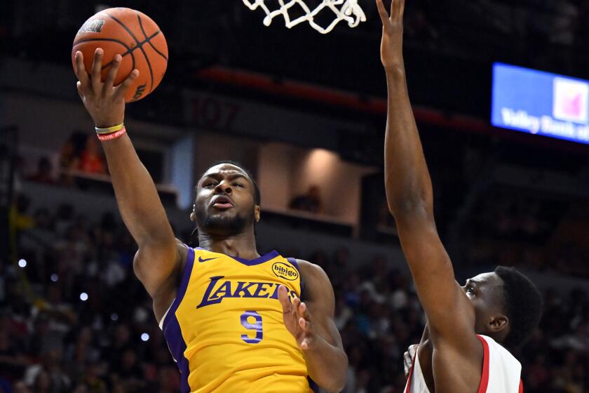 Lakers guard Bronny James shoots against Houston Rockets guard Reece Beekman 