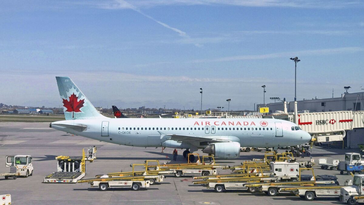 An Air Canada plane sits on the tarmac at Trudeau airport near Montreal.