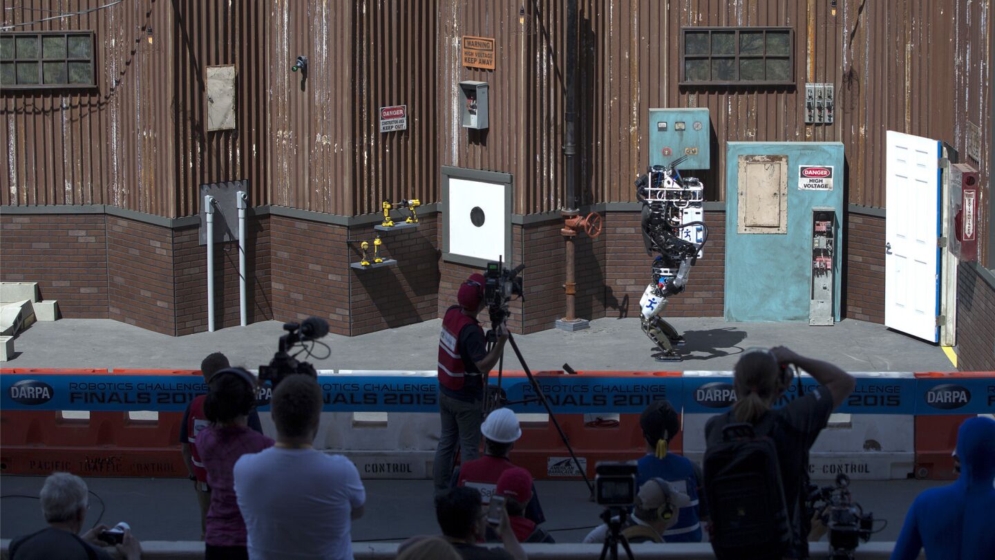 Team IHMC Robotics' Running Man makes its way through the DARPA Robotics Challenge's obstacle course.