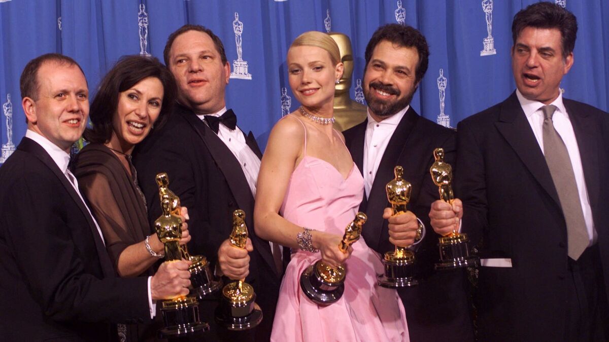 In 1999, David Parfitt, from left, Donna Gigliotti, Harvey Weinstein, Gwyneth Paltrow, Edward Zwick and Marc Norman celebrate their Oscar wins for "Shakespeare in Love."