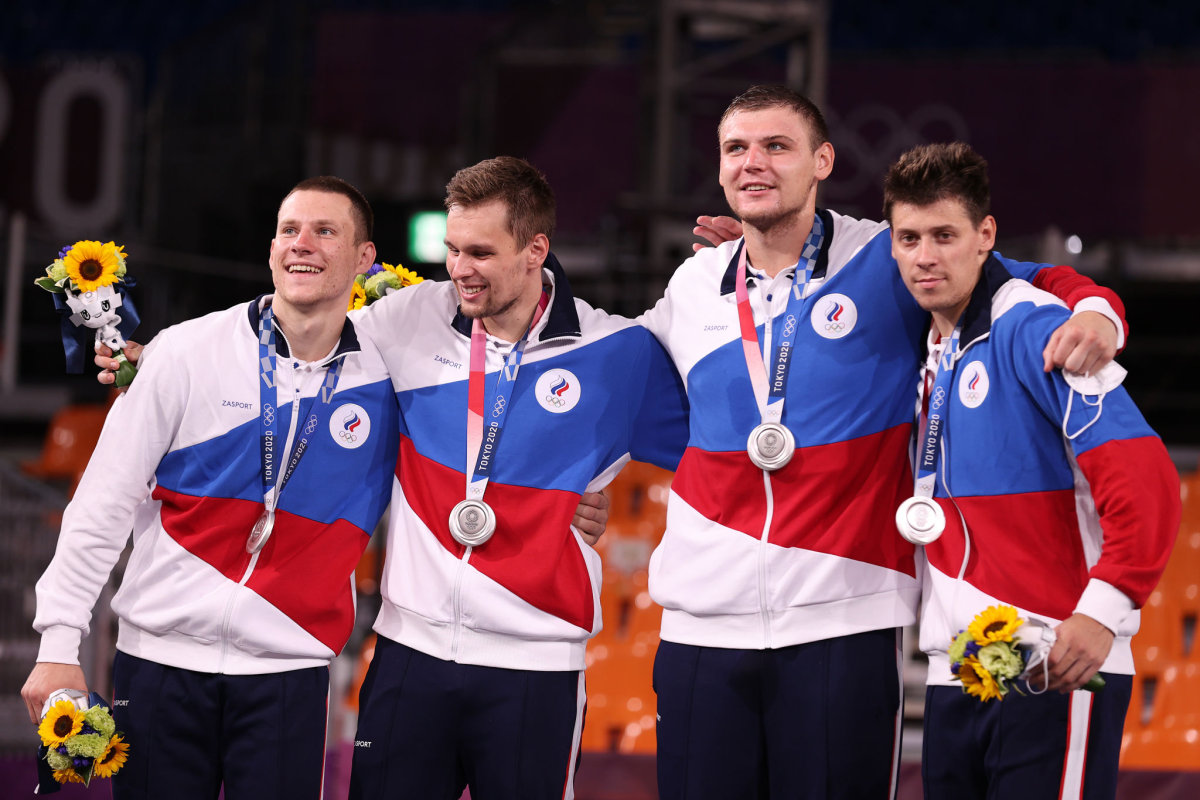 ROC 3-on-3 basketball silver medalists Stanislav Sharov, Alexander Zuev, Ilia Karpenkov and Kirill Pisklov celebrate.