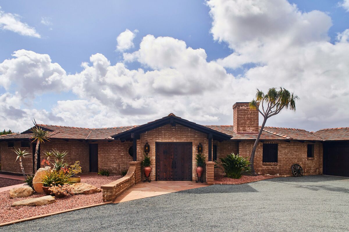 HOTCHKISS ADOBE: This ranch-style house was built for Roland and Edra Hotchkiss as a retirement home on 2 acres.