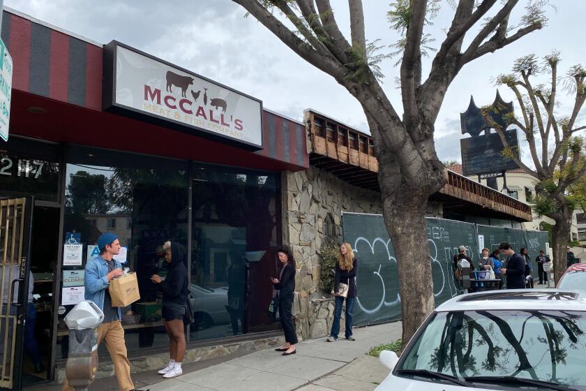 A line of customers forms outside McCall's Meat and Fish Co. in Los Feliz