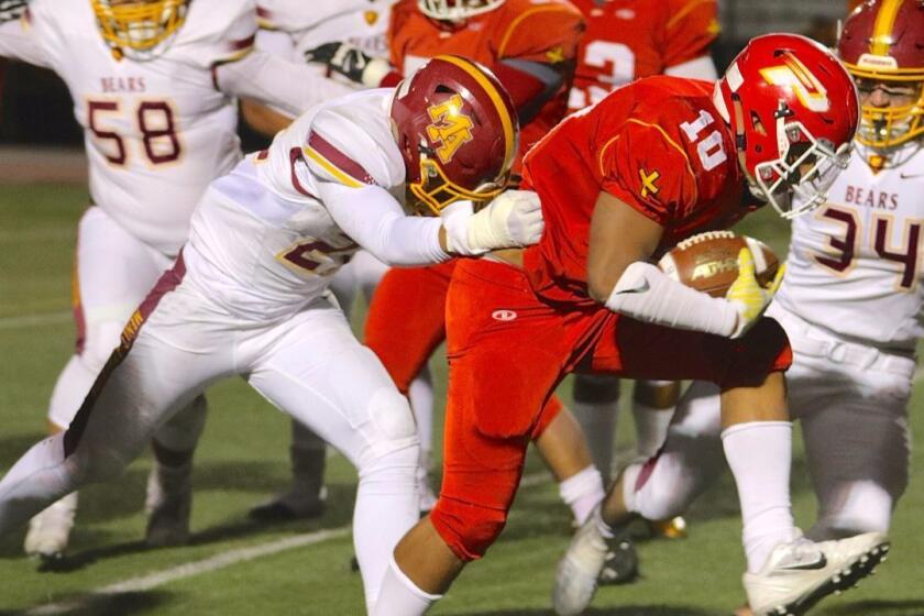 K.J. Latu crosses the goal line for the first of his three touchdowns in Paraclete's 39-21 victory over Menlo-Atherton in the CIF state Division 3-AA championship bowl game on Dec. 17.