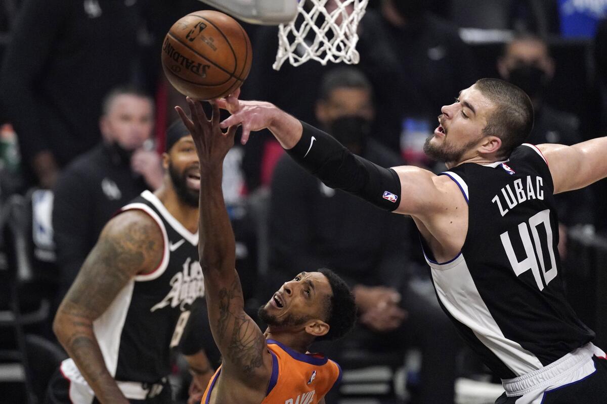 Clippers center Ivica Zubac blocks a layup by Suns guard Cameron Payne.