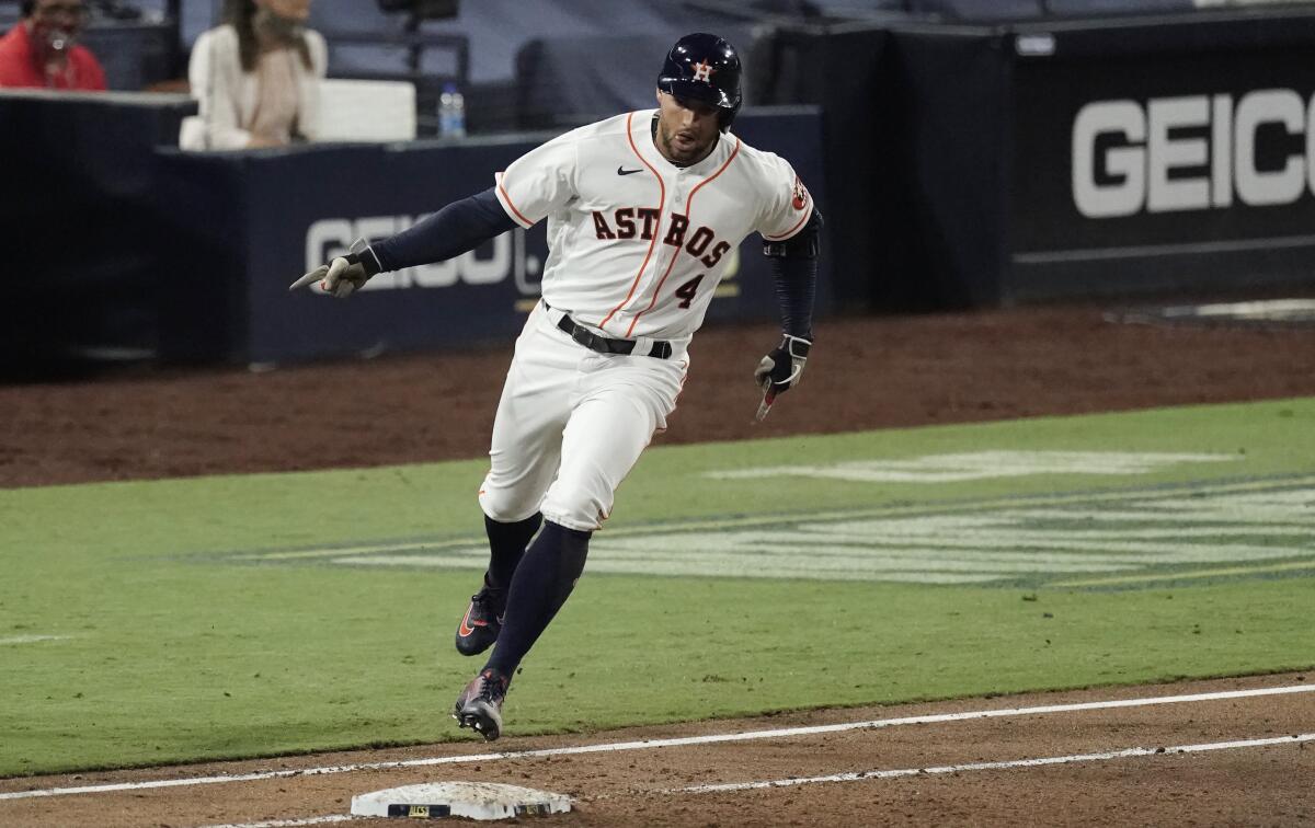 Houston Astros George Springer rounds the bases after hitting a two-run home run.