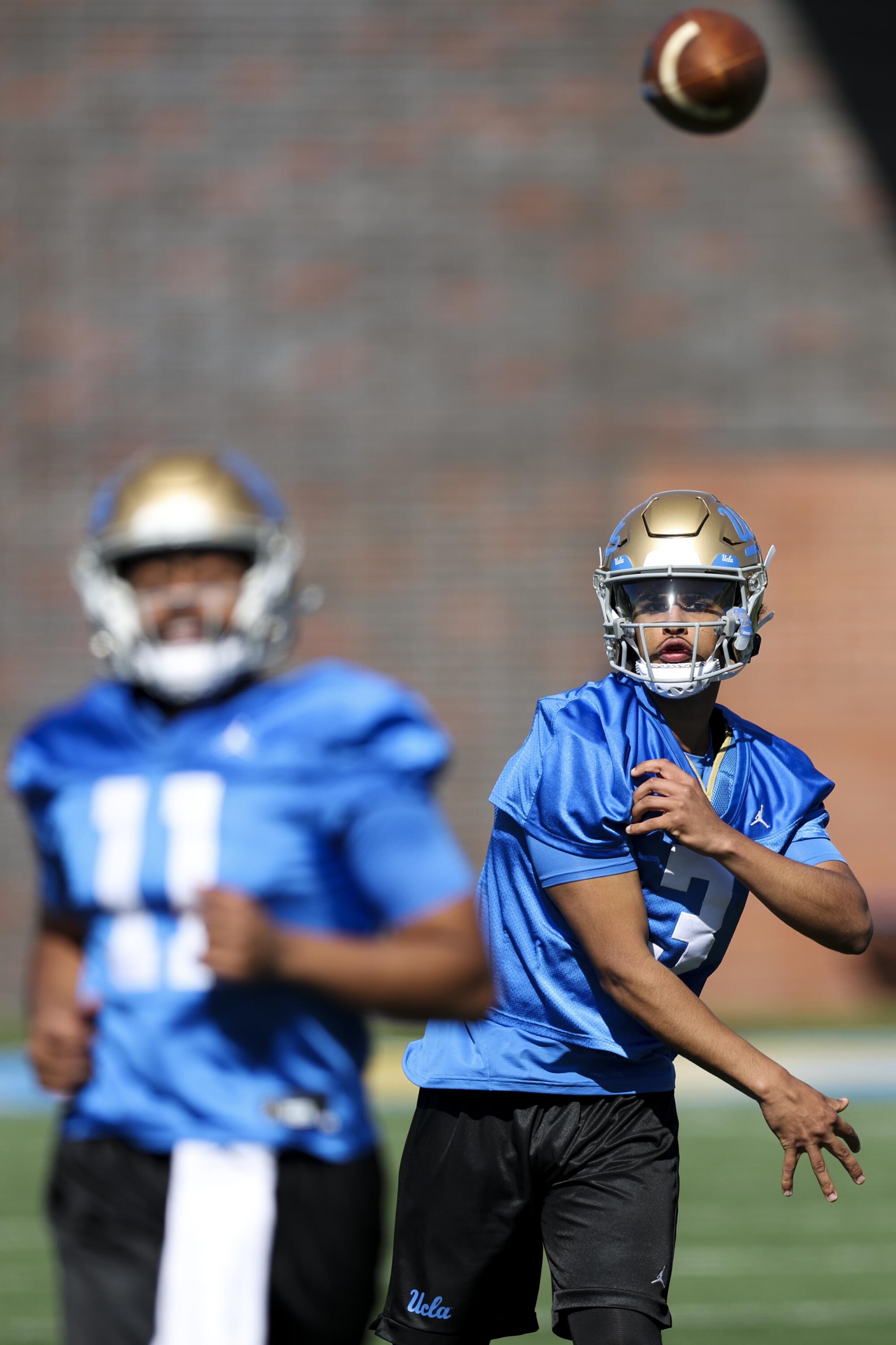 UCLA quarterback Dante Moore throws during practice. 