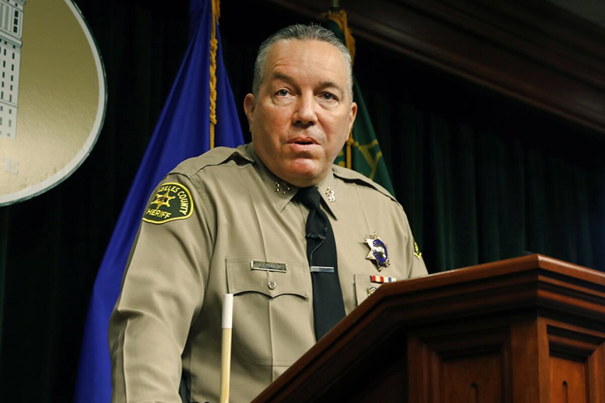 L.A. County Sheriff Alex Villanueva in uniform at a lectern