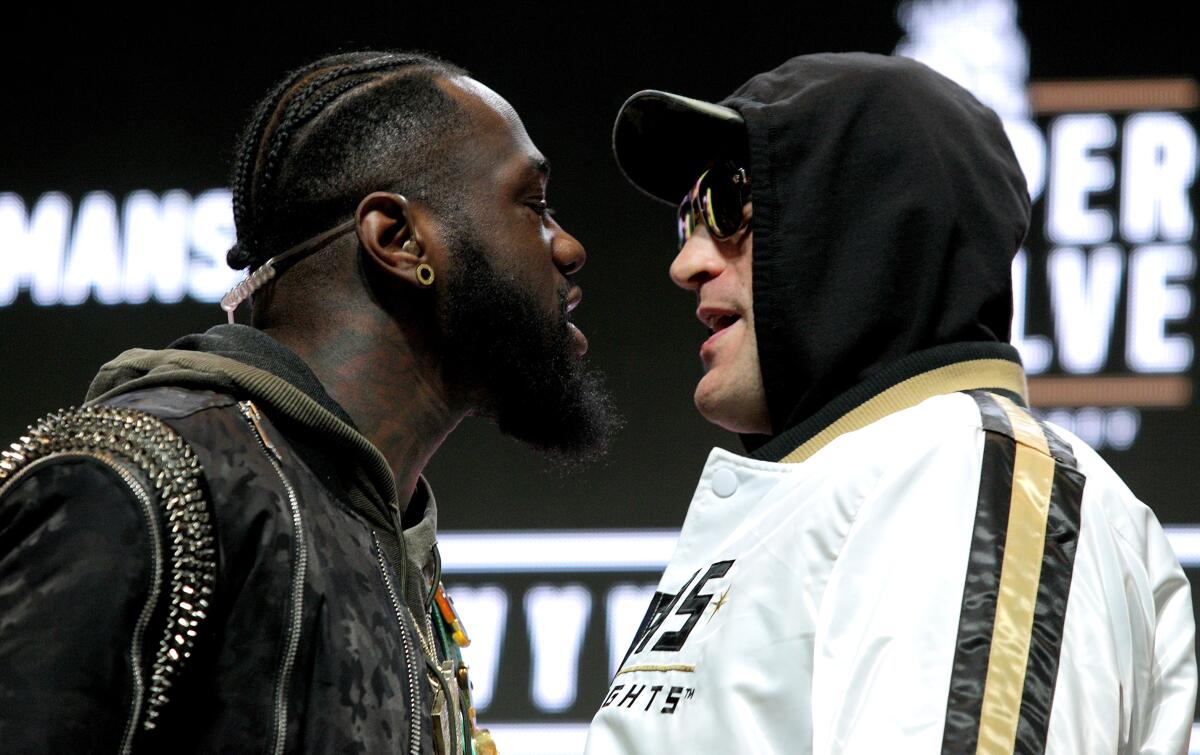 Deontay Wilder and Tyson Fury get into an altercation on stage during Wednesday's news conference.