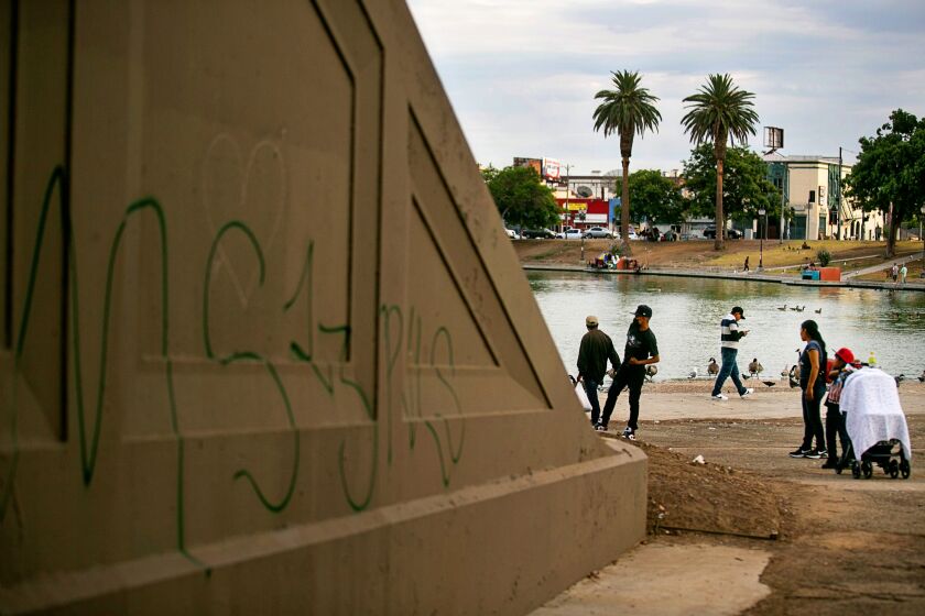 LOS ANGELES, CA - AUGUST 11: Gang related graffiti mark territory in MacArthur Park a location that has become an important source of revenue for the MS-13 gang, whose members "tax," or extort, drug dealers, gamblers, sex workers and others for permission to operate within the park on Wednesday, Aug. 11, 2021 in Los Angeles, CA. (Jason Armond / Los Angeles Times)