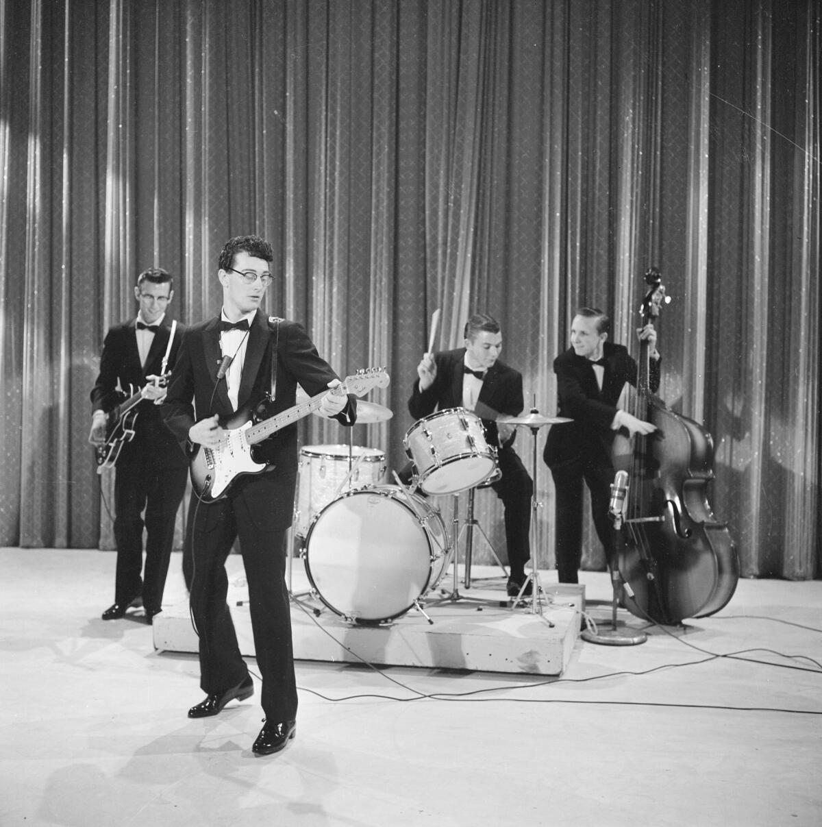 A four-man combo, with Jerry Allison on drums, performs