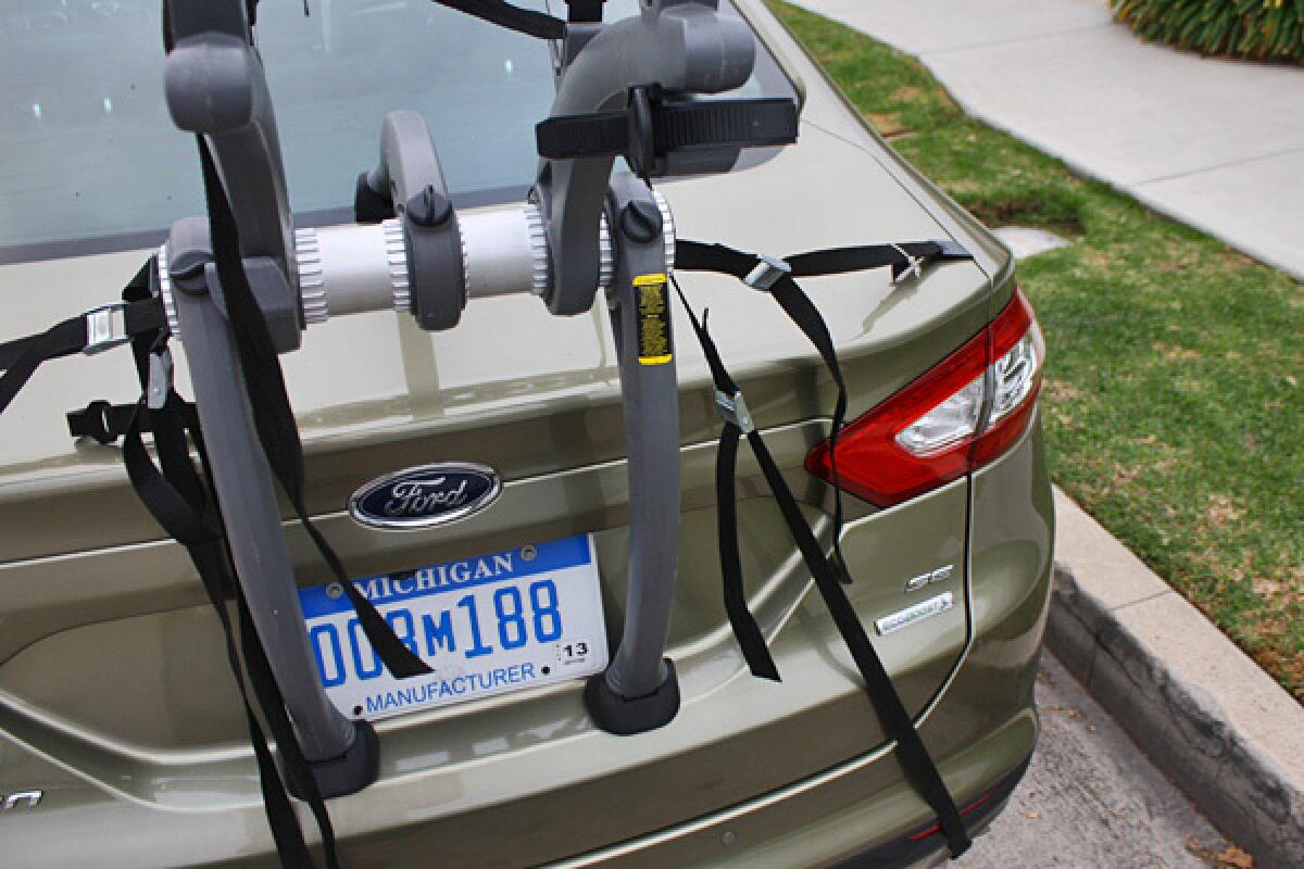 Though it may look safe, we found that rear-mounted bike racks like the one seen here aren't a great idea for the 2013 Ford Fusion.