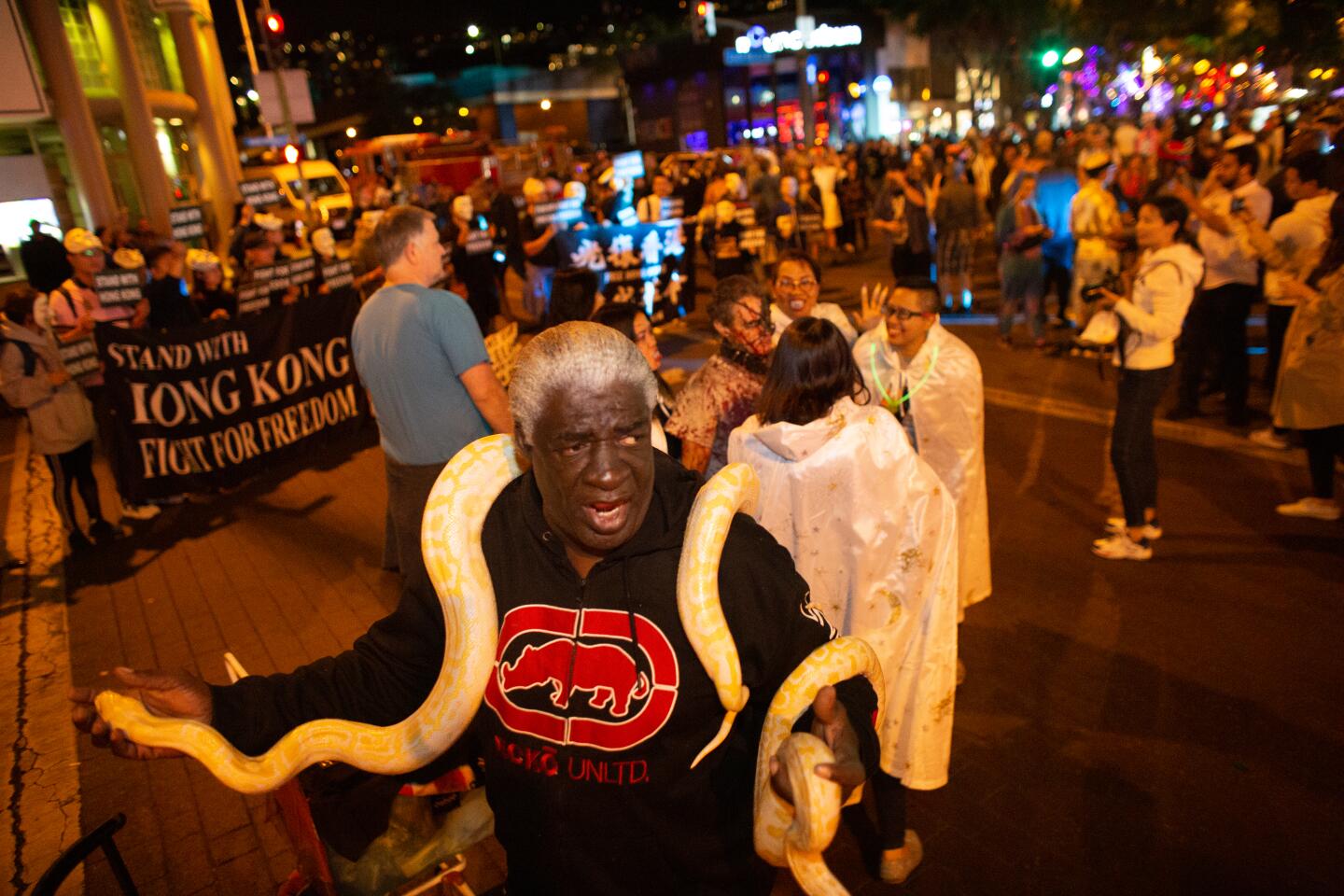 WEST HOLLYWOOD, CA OCTOBER 31, 2019— Ronald Johnson, SC, shows off his snake at the annual Halloween Carnaval, along Santa Monica Blvd. in West Hollywood on October 31, 2019. (Jason Armond/Los Angeles Times)