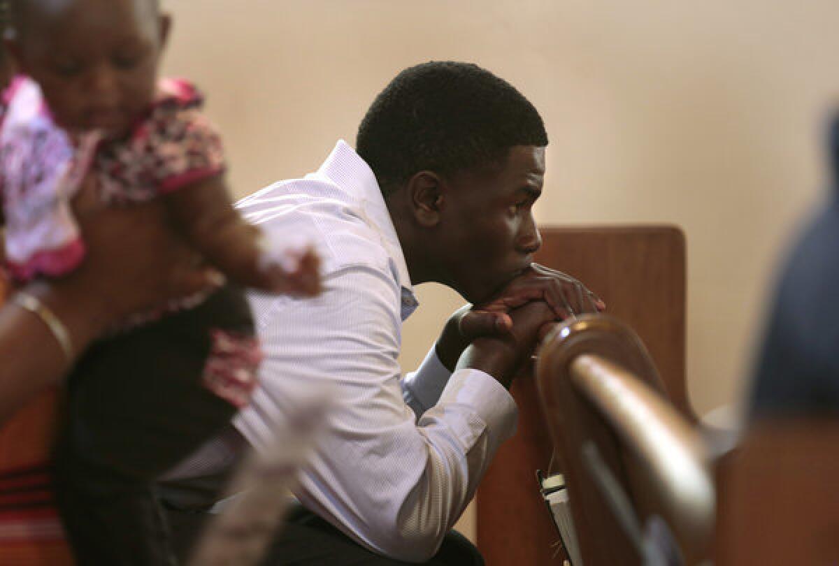 Kameron Brown, 14, attending services at Allen Chapel AME Church in Sanford, Fla., on Sunday, the day after George Zimmerman was found not guilty in the shooting death of Trayvon Martin.