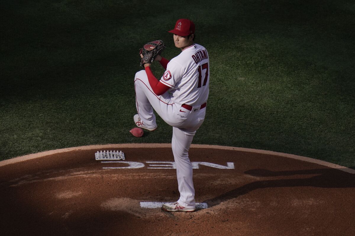 Angels starting pitcher Shohei Ohtani winds up to throw against the Cleveland Indians on May 19.