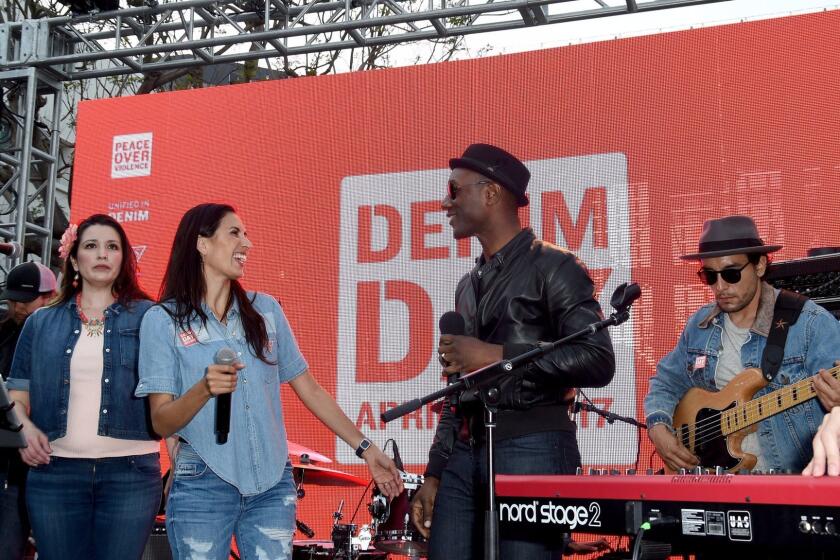 SANTA MONICA, CA - APRIL 26: Rapper Maya Jupiter (L) and Aloe Blacc perform onstage during the GUESS x Peace Over Violence support Denim Day event at Third Street Promenade on April 26, 2017 in Santa Monica, California. (Photo by Joshua Blanchard/Getty Images for GUESS, Inc.)