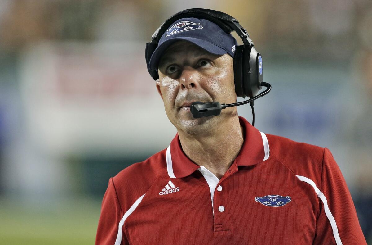 Florida Atlantic Coach Carl Pelini resigned Wednesday after less than two full seasons with the university.