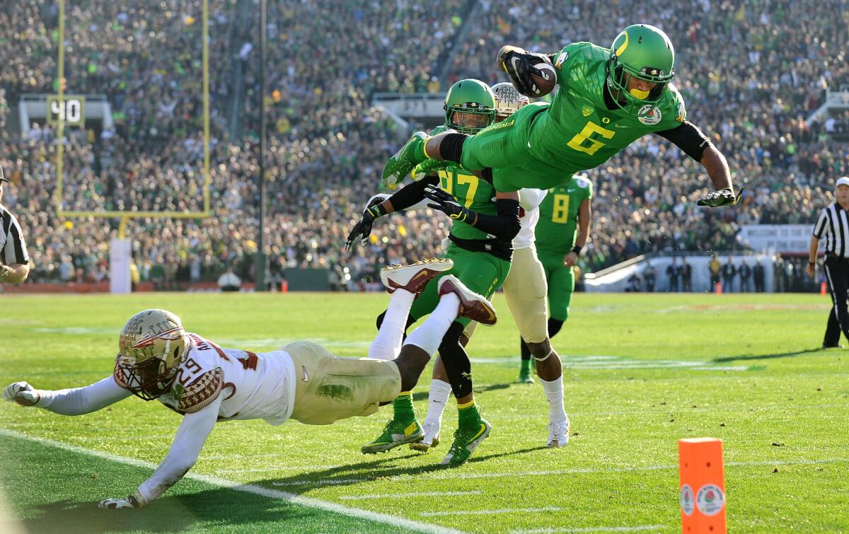 Oregon receiver Charles Nelson dives for the goal line after evading Florida State defensive back Nate Andrews in the first quarter of the Rose Bowl game on Jan. 1.