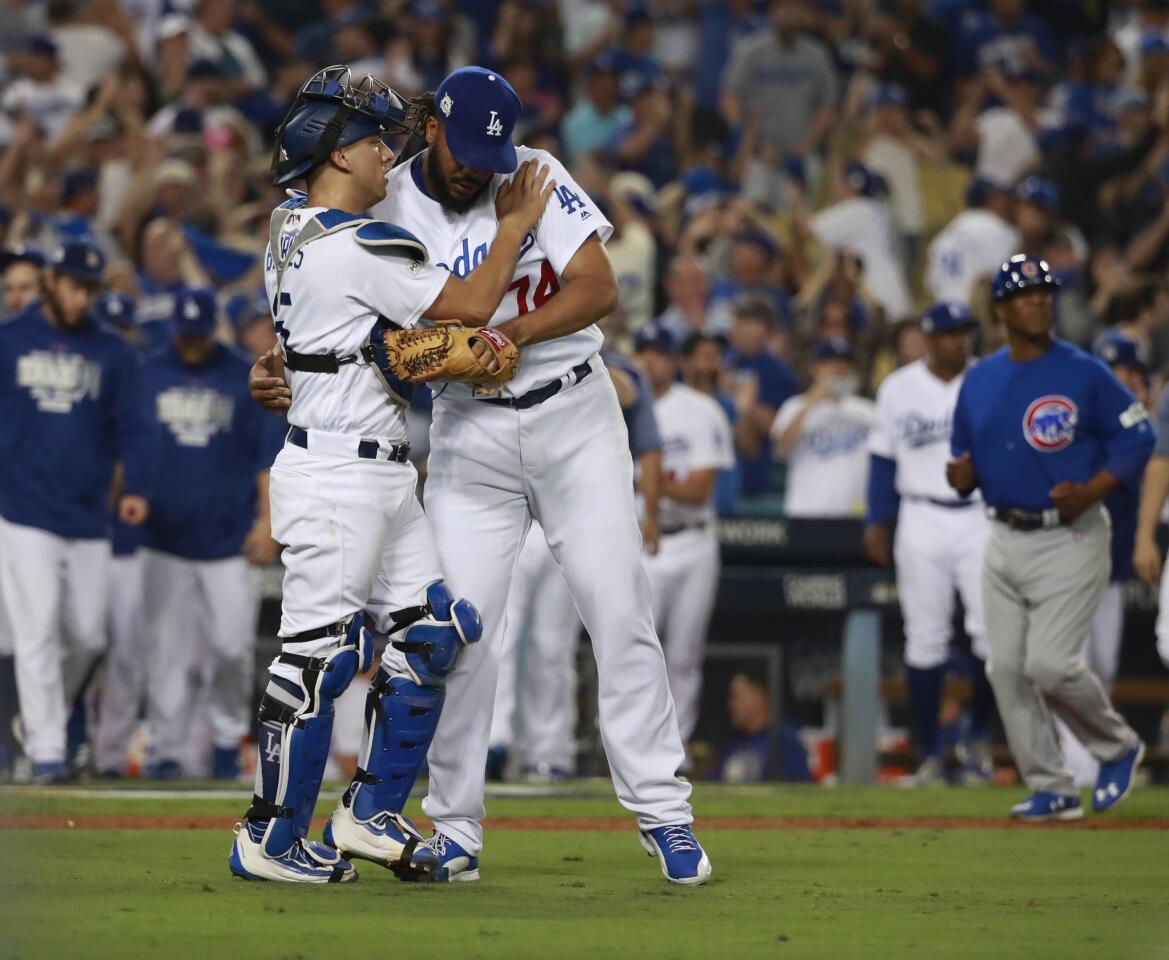 Dodgers catcher Austin Barnes congratulates Dodgers closer Kenley Jansen after their win.