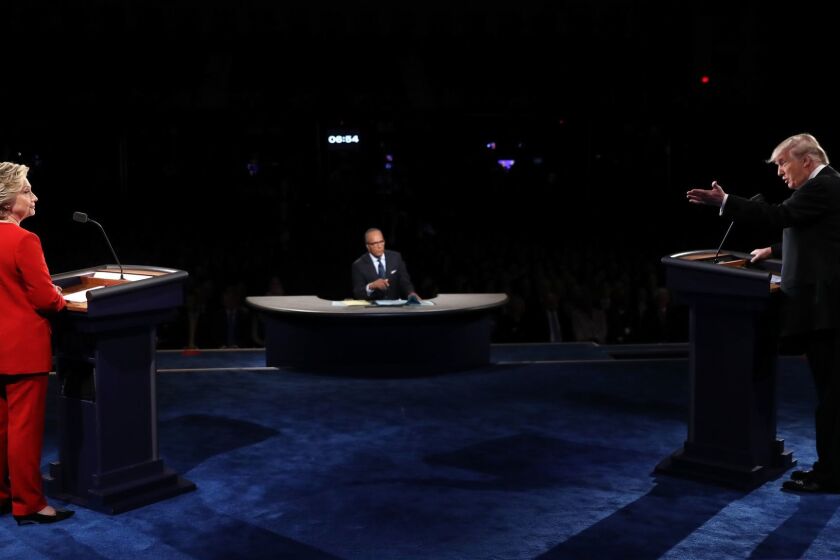 HEMPSTEAD, NY - SEPTEMBER 26: Republican presidential nominee Donald Trump (R) speaks as Democratic presidential nominee Hillary Clinton and Moderator Lester Holt listens during the Presidential Debate at Hofstra University on September 26, 2016 in Hempstead, New York. The first of four debates for the 2016 Election, three Presidential and one Vice Presidential, is moderated by NBC's Lester Holt. (Photo by Joe Raedle/Getty Images) ** OUTS - ELSENT, FPG, CM - OUTS * NM, PH, VA if sourced by CT, LA or MoD **