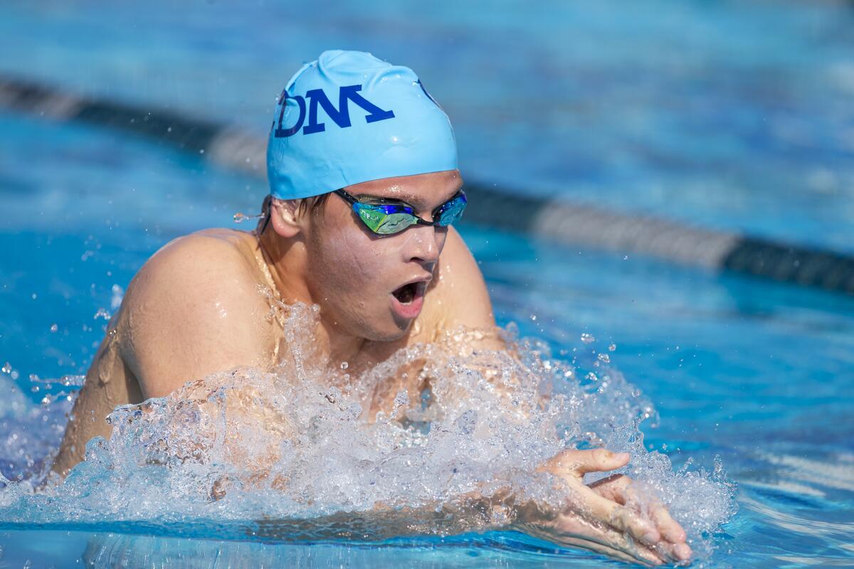Corona del Mar's Jake Kubichek swims the breaststroke in the boys' 200 individual medley.  