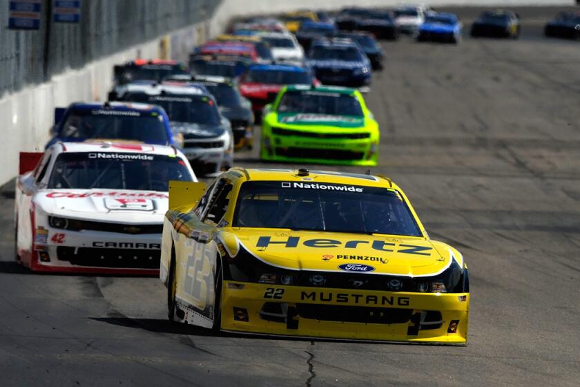 Brad Keselowski, driving the No. 22 Hertz Ford, leads a pack of cars during the NASCAR Nationwide Series Sta-Green 200 at New Hampshire Motor Speedway on Saturday.