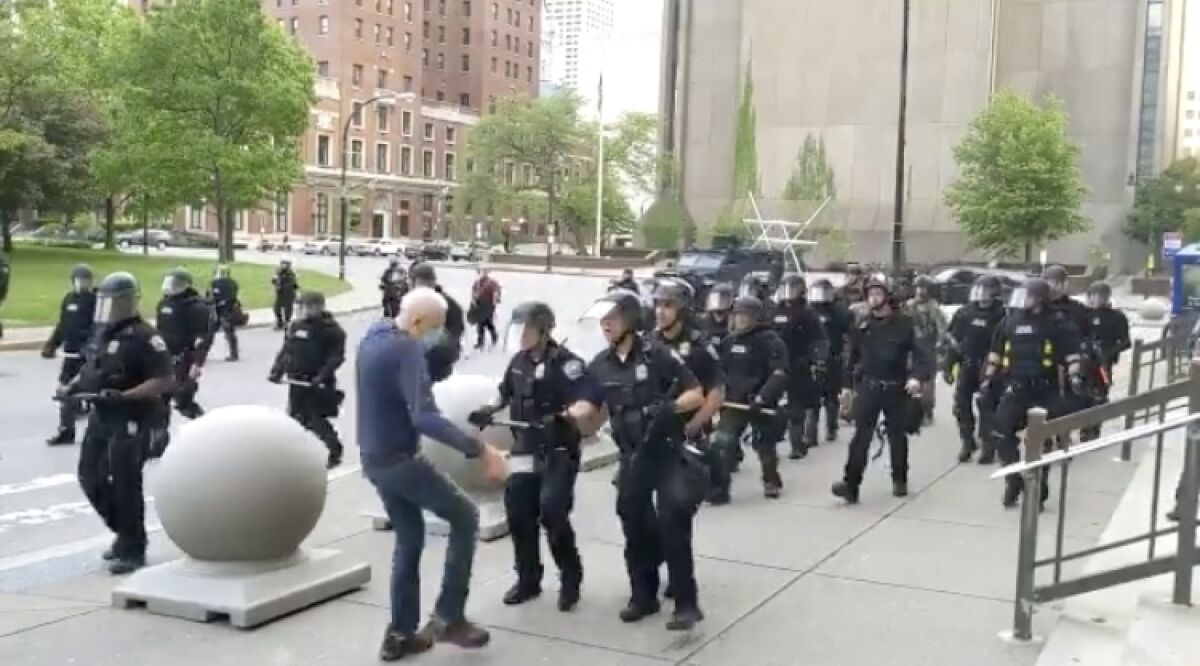 A police officer in Buffalo, N.Y., can be seen shoving demonstrator Martin Gugino on June 4.